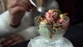 Eating dessert close up. Clip. Woman tasting creamy dessert Close - up of young woman eating ice crea. Close - up of Royalty Free Stock Photo