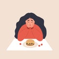 Eating disorder. Sad woman looks at hamburger and worries about being overweight. Overeating, bulimia, anorexia. Food