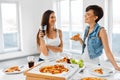 Eating Fast Food. Friends Eating Pizza. Home Party. Leisure, Celebration. Royalty Free Stock Photo