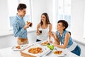 Eating Food. Friends Having Home Dinner Party. Friendship, Leisure Concept. Royalty Free Stock Photo