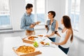 Eating Food. Friends Having Home Dinner Party. Friendship, Leisure Concept. Royalty Free Stock Photo