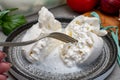 Eating of fresh handmade soft Italian cheese from Puglia, white balls of burrata or burratina cheese made from mozzarella and