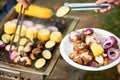 Eating grilled vegetables outdoors