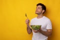 Portrait of Smiling Guy Holding Bowl With Salad Royalty Free Stock Photo