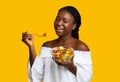 Eating Healthy. Smiling Black Woman Having Bowl Of Vegetable Salad For Lunch Royalty Free Stock Photo