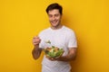 Portrait of Smiling Guy Holding Bowl With Salad Royalty Free Stock Photo