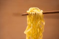 Eating Instant noodles with a wooden chopstick. Royalty Free Stock Photo