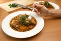 Eating lamb stew Royalty Free Stock Photo