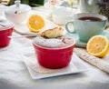 Eating lemon pudding with red plates, English Tea Party Royalty Free Stock Photo