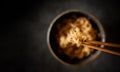 Eating Noodle by using a Bamboo Wooden Traditional Chopsticks. Selective Focus Royalty Free Stock Photo