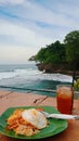 eating noodles and drinking iced tea on Pandeglang beach, Banten Royalty Free Stock Photo