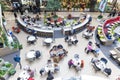 Eating people at tables at the food court in the mall. Top view. Russia, Moscow, 2022-10-07