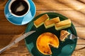 Eating piece cheese cake with matcha cakes and cup of coffee at background in a sunny morning horizontal composition Royalty Free Stock Photo