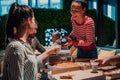 Eating pizza with diverse colleagues in the office, happy multi-ethnic employees having fun together during lunch Royalty Free Stock Photo