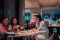 Eating pizza with diverse colleagues in the office, happy multi-ethnic employees having fun together during lunch Royalty Free Stock Photo