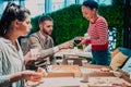 Eating pizza with diverse colleagues in the office, happy multi-ethnic employees having fun together during lunch Royalty Free Stock Photo