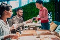 Eating pizza with diverse colleagues in the office, happy multi-ethnic employees having fun together during lunch Royalty Free Stock Photo