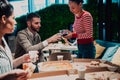 Eating pizza with diverse colleagues in the office, happy multi-ethnic employees having fun together during lunch Royalty Free Stock Photo