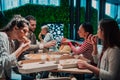 Eating pizza with diverse colleagues in the office, happy multi-ethnic employees having fun together during lunch Royalty Free Stock Photo