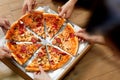 Eating Pizza. Group Of Friends Sharing Pizza. Fast Food, Leisure Royalty Free Stock Photo