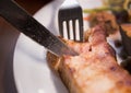 Eating pork steak Royalty Free Stock Photo