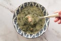 Eating portuguese kale soup called caldo verde Royalty Free Stock Photo