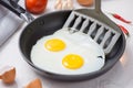 Eating in the process, fried eggs in a frying pan for breakfast Royalty Free Stock Photo