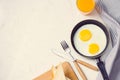 Eating in the process, fried eggs in a frying pan, toast and or Royalty Free Stock Photo