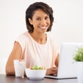 Eating, salad and woman working with laptop and healthy food or nutrition in home and office. Happy, portrait and hungry