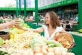 Eating Series: Young Woman Buying Cabbage at Grocery Market Royalty Free Stock Photo