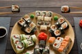 Eating set of sushi maki and rolls in japanese resaturant Royalty Free Stock Photo