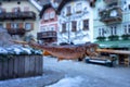 eating skewered fish in Hallstatt at the christmas market on main square