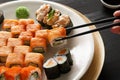 Eating sushi rolls at japanese food restaurant Royalty Free Stock Photo