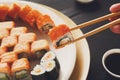 Eating sushi rolls at japanese food restaurant Royalty Free Stock Photo