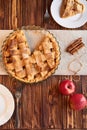 Tasty homemade apple pie. American pie. Apples. Cinnamon. Plate. Linen towel. Wooden background. Top view Royalty Free Stock Photo