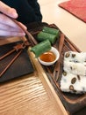 Eating sweet tteok korean rice cake in teahouse