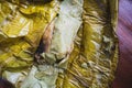 Eating Tamales in Oaxaca, Mexico. The tamale is masa filled with mole negro..