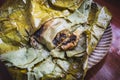 Eating Tamales in Oaxaca, Mexico. The tamale is masa filled with mole negro..