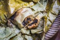 Eating Tamales in Oaxaca, Mexico. The tamale is masa filled with mole negro..