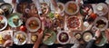 Eating together. Table full of food, from above, wide view. Enjoying food, dining with family, friends. Royalty Free Stock Photo