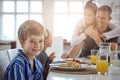 Eating together is very important to our family. a family having breakfast together.