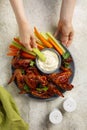Eating vegetables and baked spicy BBQ Chicken Wings Royalty Free Stock Photo