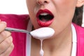 Eating yoghurt close up Royalty Free Stock Photo