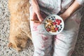 Eating yogurt with granola and berries. Female eating healthy breakfast Royalty Free Stock Photo