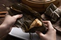 Eating zongzi rice dumpling for Dragon Boat Festival celebration