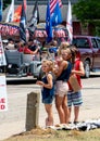 Children watch a parade on the 4th of july