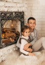 Eautiful little girl and boy are in the bedroom with Christmas decoration Royalty Free Stock Photo