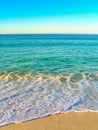 Ebb and flow of the ocean at a beach in the Bay of Fires, Tasmania, Australia. Royalty Free Stock Photo