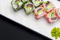 Ebiko black caviar adn red caviar sushi rolls - japanese food style. Served on a white plate over black background Royalty Free Stock Photo