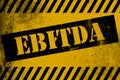 Ebitda sign yellow with stripes